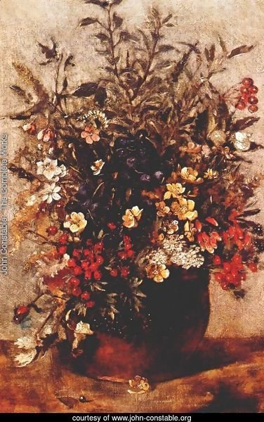 Autumn berries and flowers in brown pot